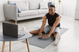 black man doing stretching workout exercise at lap 2022 12 16 09 03 17 utc